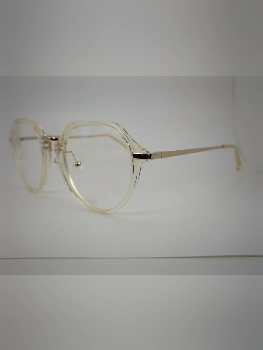 Tamara. Clear Round Frame Glasses with Gold Accents. Nose Pads. Metal Bridge